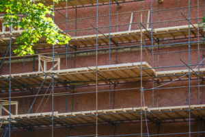scaffolding brick wall masonry restoration old building